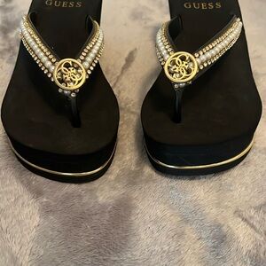 Guess Black and Gold Sandals with Shimmery Medallion